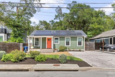 View of front facade with a porch, solar panels, 