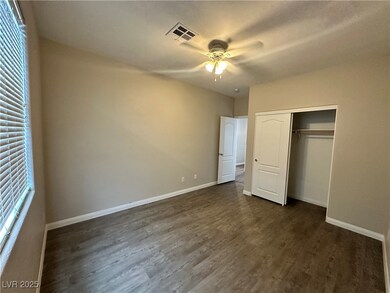 Unfurnished bedroom featuring dark wood-style floo