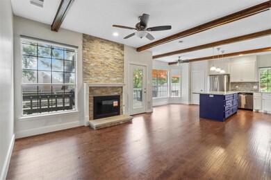 Unfurnished living room featuring hardwood / wood-