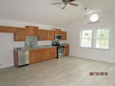 KITCHEN AREA WITH GRANITE COUNTER...
