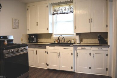 Bright kitchen with window overlooking the back ya