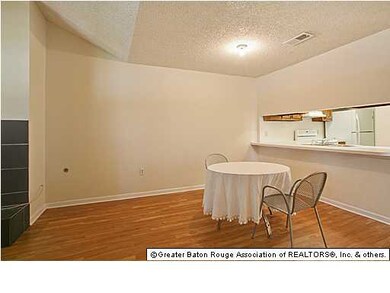 Dining area with bar to kitchen.