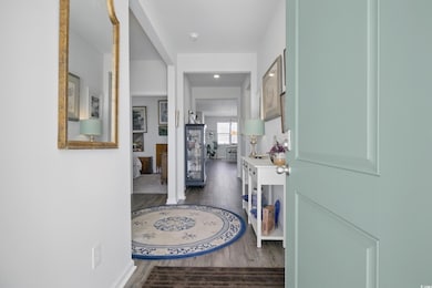 Foyer featuring wood finished floors and baseboards