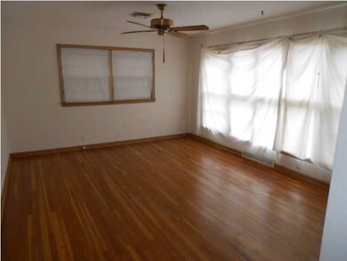 BIG LIVING ROOM WITH NICE HARD WOOD FLOORS