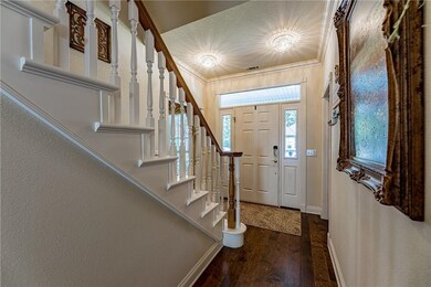 Front entrance leads to office, formal dining room, living room and upstairs.