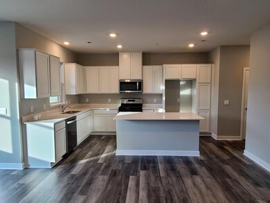 Fairfax Kitchen shown with white cabinets and quartz countertops.  Photo is of actual home.