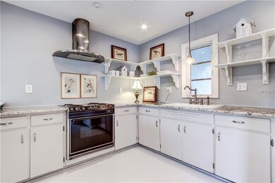 Updated Kitchen with Granite Counter Tops and Wood