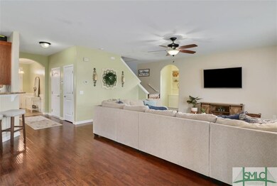 Living room with view into office with full bath n