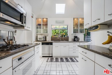 Kitchen with Garden Window and Skylight