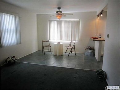 Dining room area opens to kitchen.,