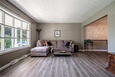 Large bowed picture window lets plenty of sunlight