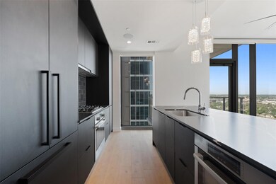 Kitchen featuring tasteful backsplash, modern cab
