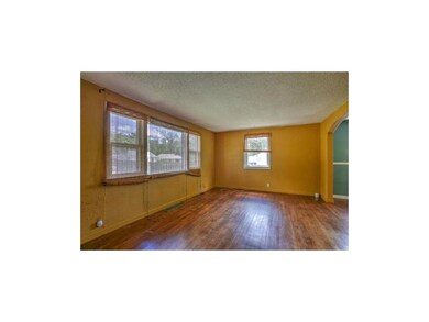 Hardwoods throughout the living room w/picture win
