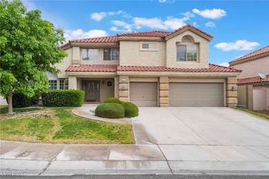 Mediterranean / spanish-style home with an attache