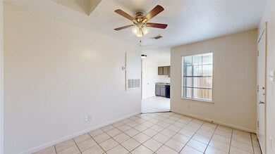 Unfurnished room featuring ceiling fan, light tile