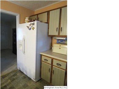 Additional counter space and photo of the refriger
