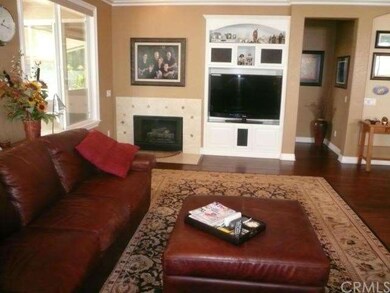 Big view great room with wood floors, tile firepla