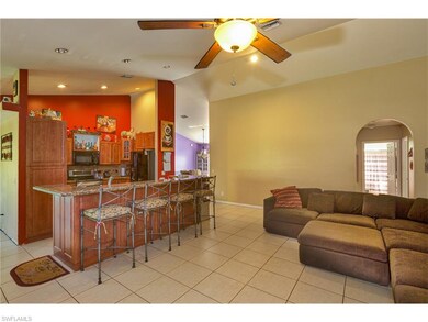 Family room with kitchen in background