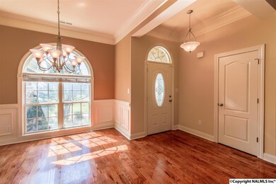 Your friends and family will enjoy lots of dinners in the elegance of this room.  Notice the beautiful hardwood floors and nice trim work
