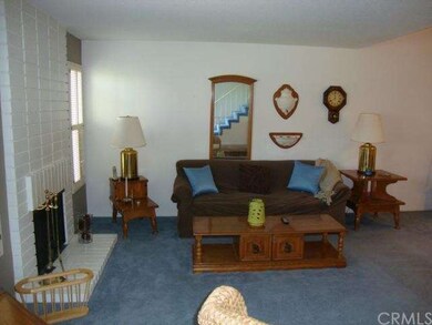 Living room off of entry with cozy fireplace for t