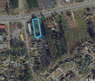 Aerial map of property and surrounding area with property parcel outlined