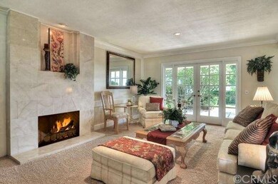 Formal living room, french doors lead to back pati