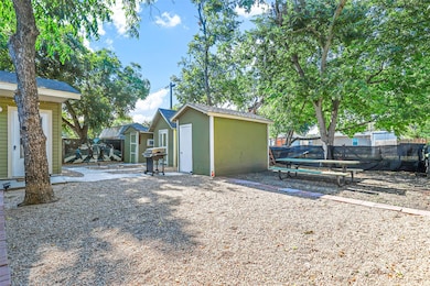 View of yard with an outbuilding and a patio area