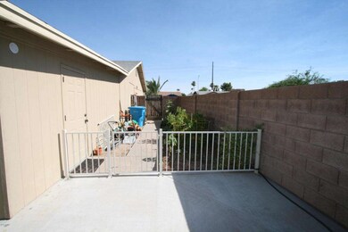 Side yard with gate and office access.