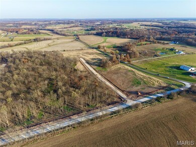 Aerial view of sparsely populated area with extensive farmland