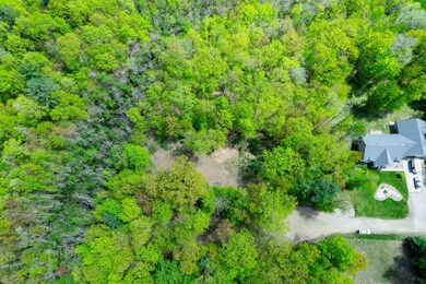 Great view of lot, cleared building site, and neighboring home to the west.