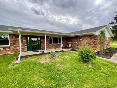 Front porch, newer entry door, perennials golore