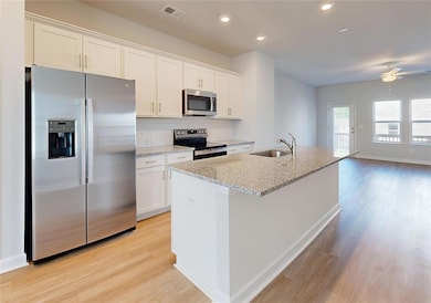 Kitchen featuring appliances with stainless steel 