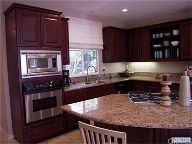 gourmet kitchen with island center and granite cou