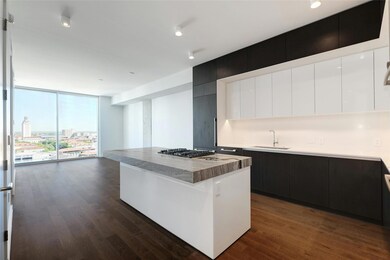 Kitchen featuring modern cabinets, a wall of wind