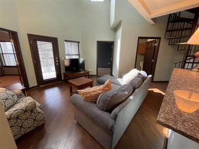 Living area featuring dark wood-type flooring, a 