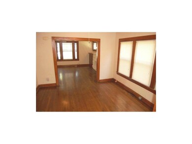 Dining room in the lower unit. Large windows in th