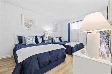 Bedroom with light hardwood / wood-style floors