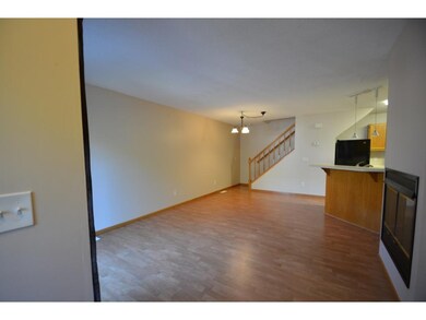 Open floor plan with laminate flooring, cozy gas f