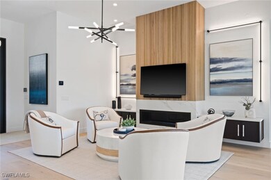 Living room featuring a notable chandelier and lig