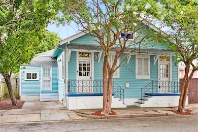 Front of home, driveway to left, mudroom/laundry e