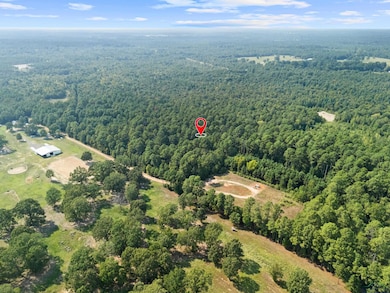 View of property location featuring a heavily wooded area