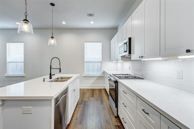 Large kitchen island with breakfast bar, quartz co
