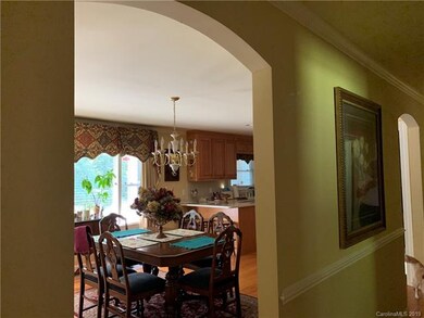 Arched openings into dining room from main hallway
