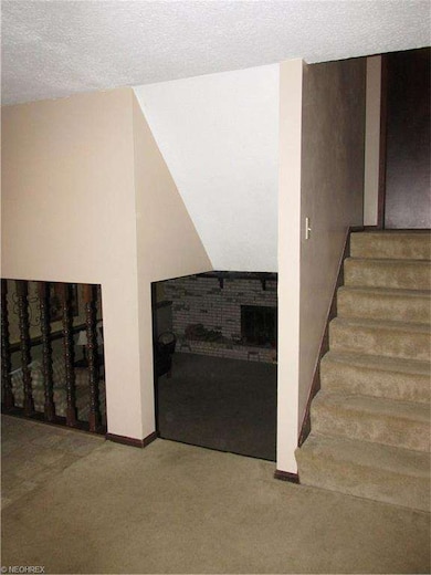 View from livingroom to family room and upstairs.