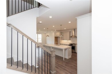 Upon entering the home, open concept, nice drop area at the front for a nice piece of furniture for keys, purses, shoes, etc. Pictures represent a previously built home, not the actual home.