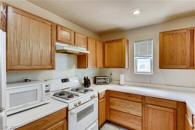 Kitchen features a garden window, a plethora of co