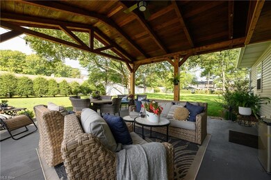 View of terrace featuring a gazebo and an outdoor 