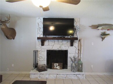 Rustic looking Wood burning fireplace and mantle -