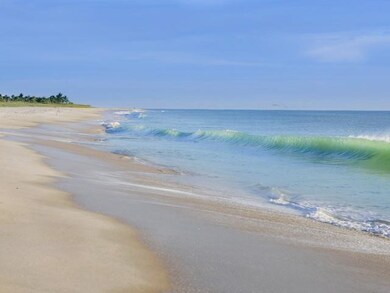 Water view featuring nearby beach. Moorings has deeded beach access, tiki huts and member/resident parking.