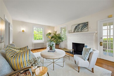 Living room featuring radiator, wood finished floo